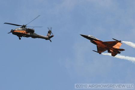 The Royal Netherlands Air Force's Apache Helicopter Demo Team, who did such an unbelievable demonstration with their wildly painted Apache helicopter doing rolls and loops, and their black and orange F-16AM who flew along side the Apache